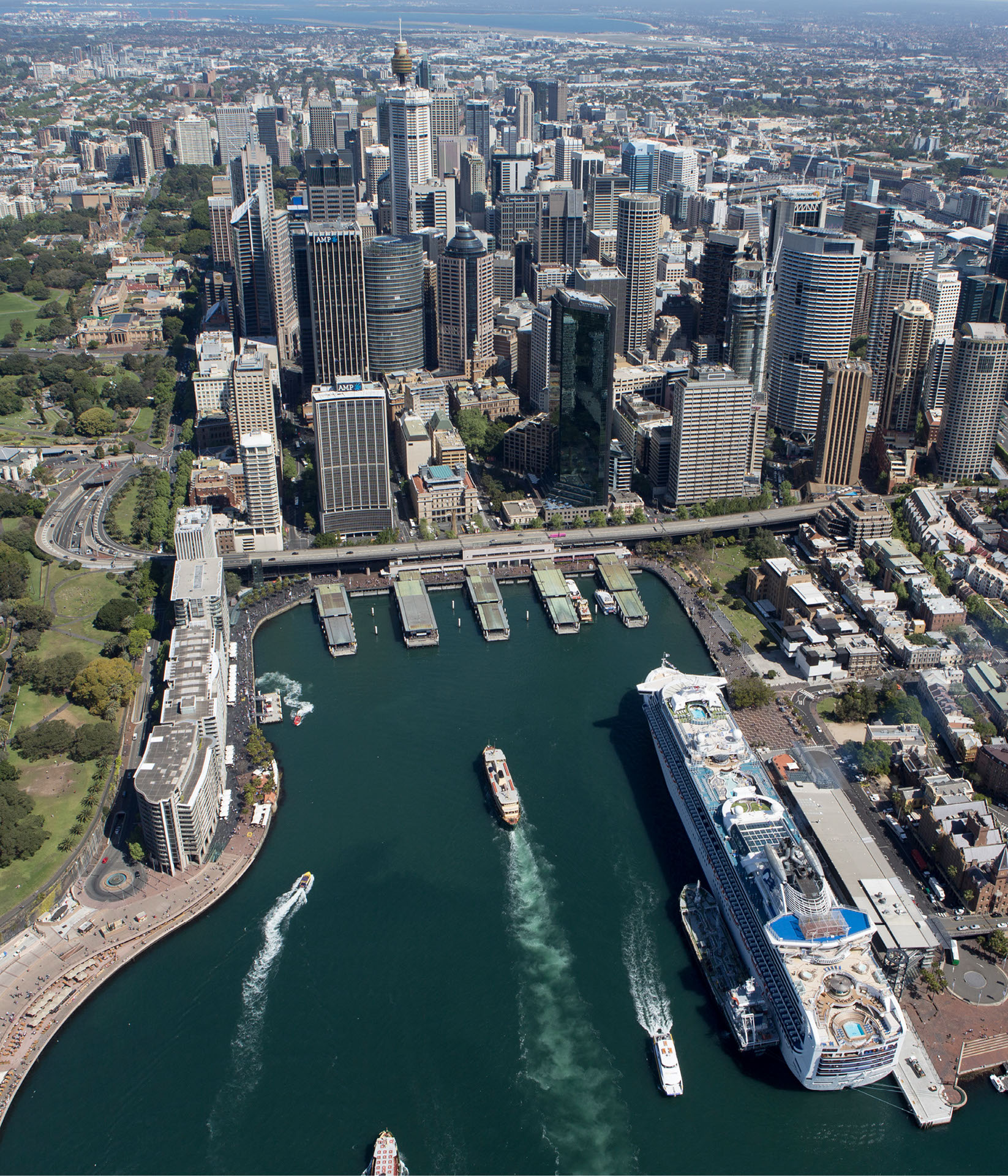 Aerial view of the Overseas Passenger Terminal in Sydney, showing the terminal with Sydney CBD skyline in the background.
